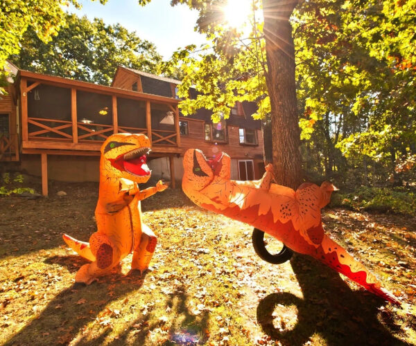 New Hampshire Homeowners Enlist a T-Rex Squad To Help Sell Their Home—and the Photos Are Hilarious